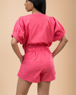 Linen Pink Romper with Button Front Elastic Waist, V-neck, Elastic Cuffs, and Short Dolman Sleeves